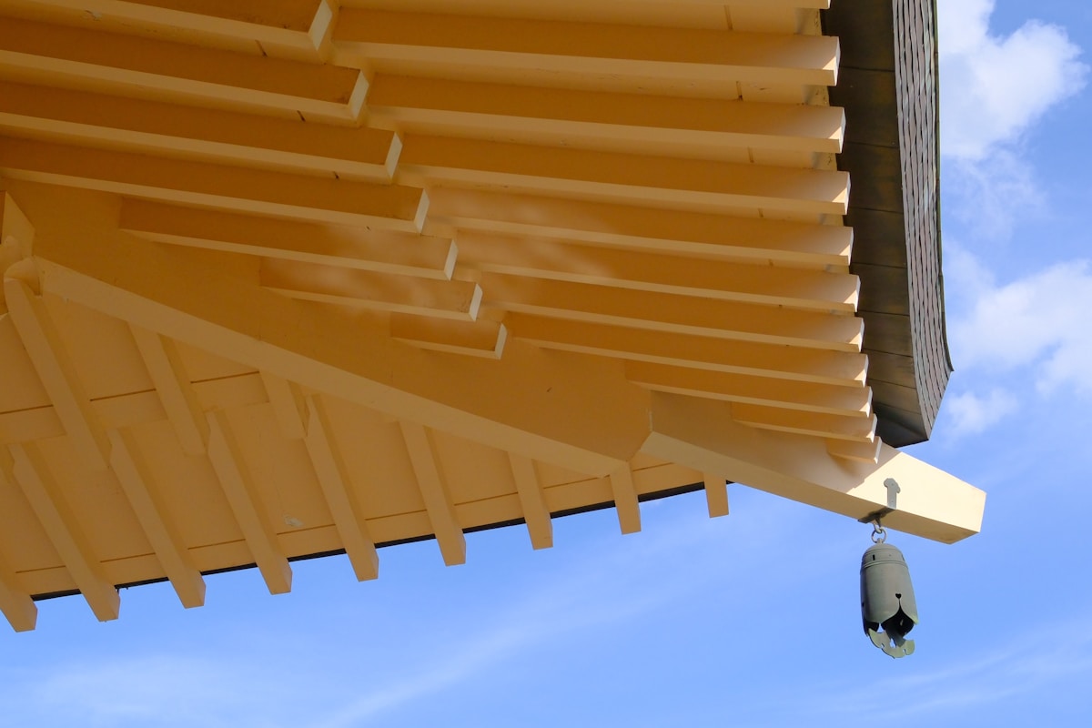 Close-up of a pagoda roof with a bell
